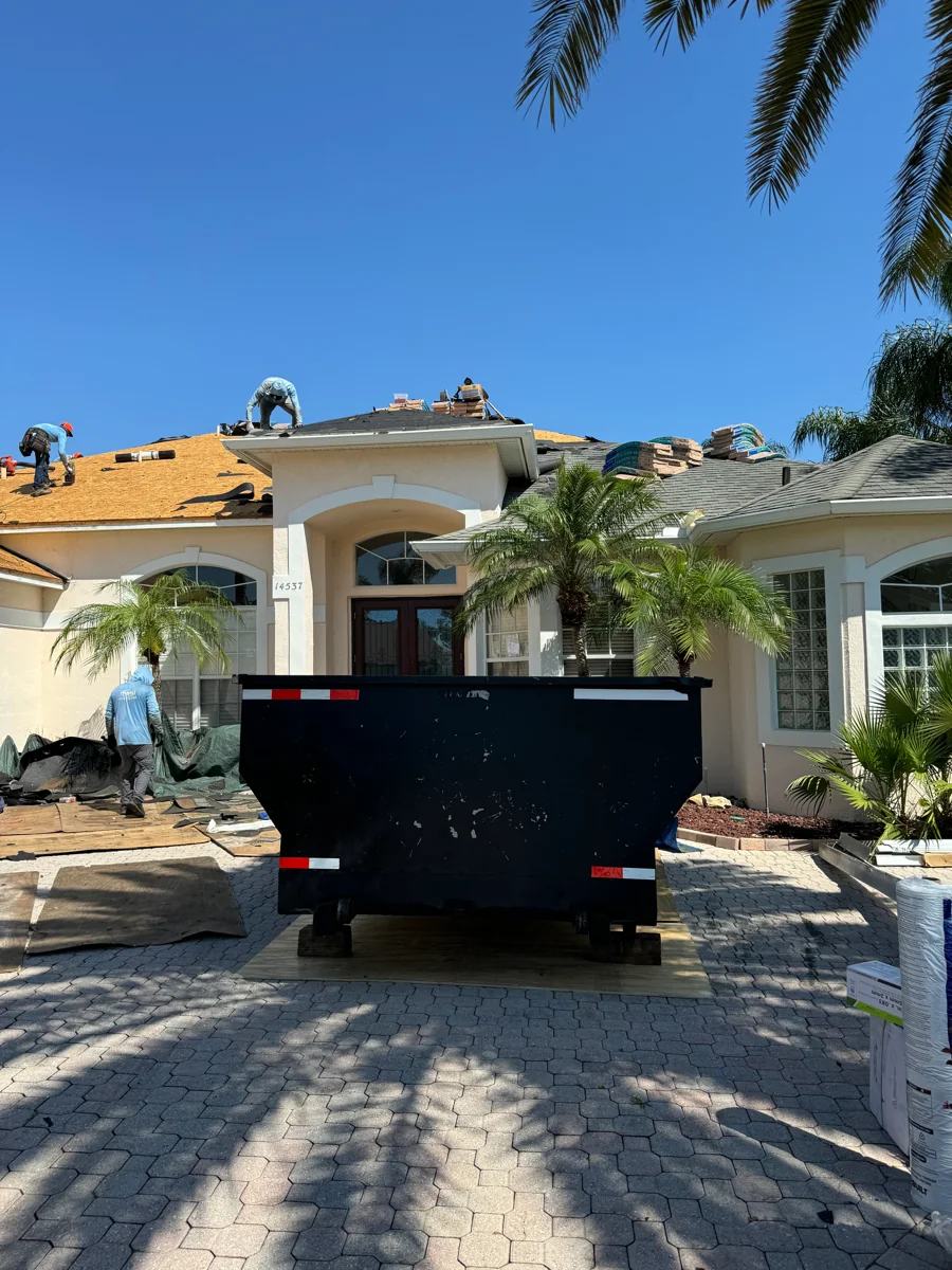 GM dumpster in front of a home